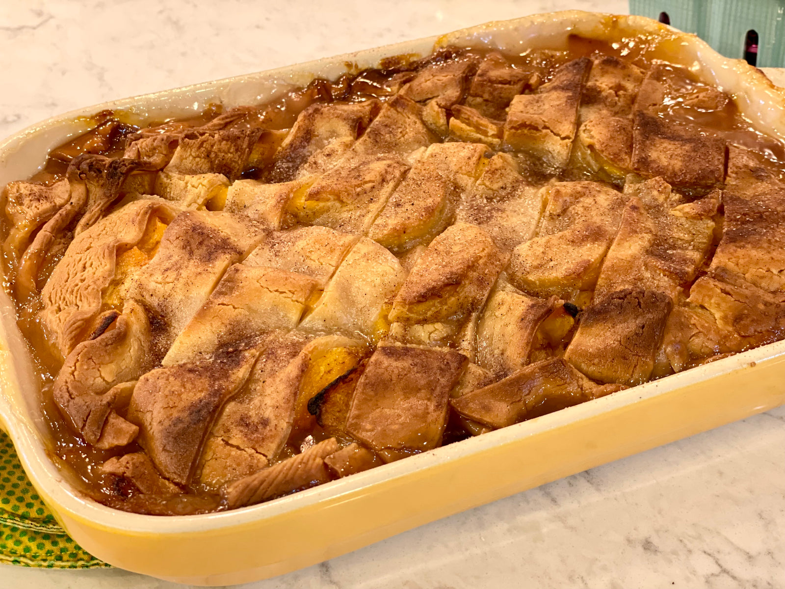Peach Cobbler Baked in a Yellow Dish